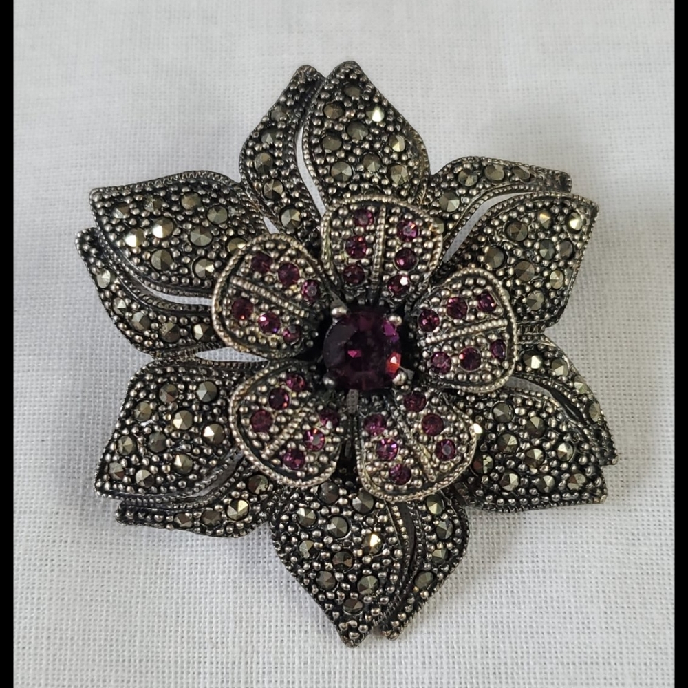 Costume flower brooch with embellishments